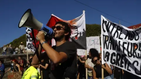 France-Wide Strikes Erupt Against Budget Reductions